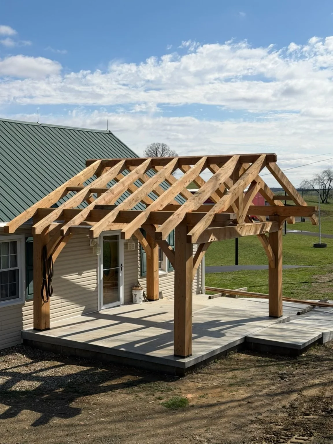 Angled view of hemlock timber-frame patio structure