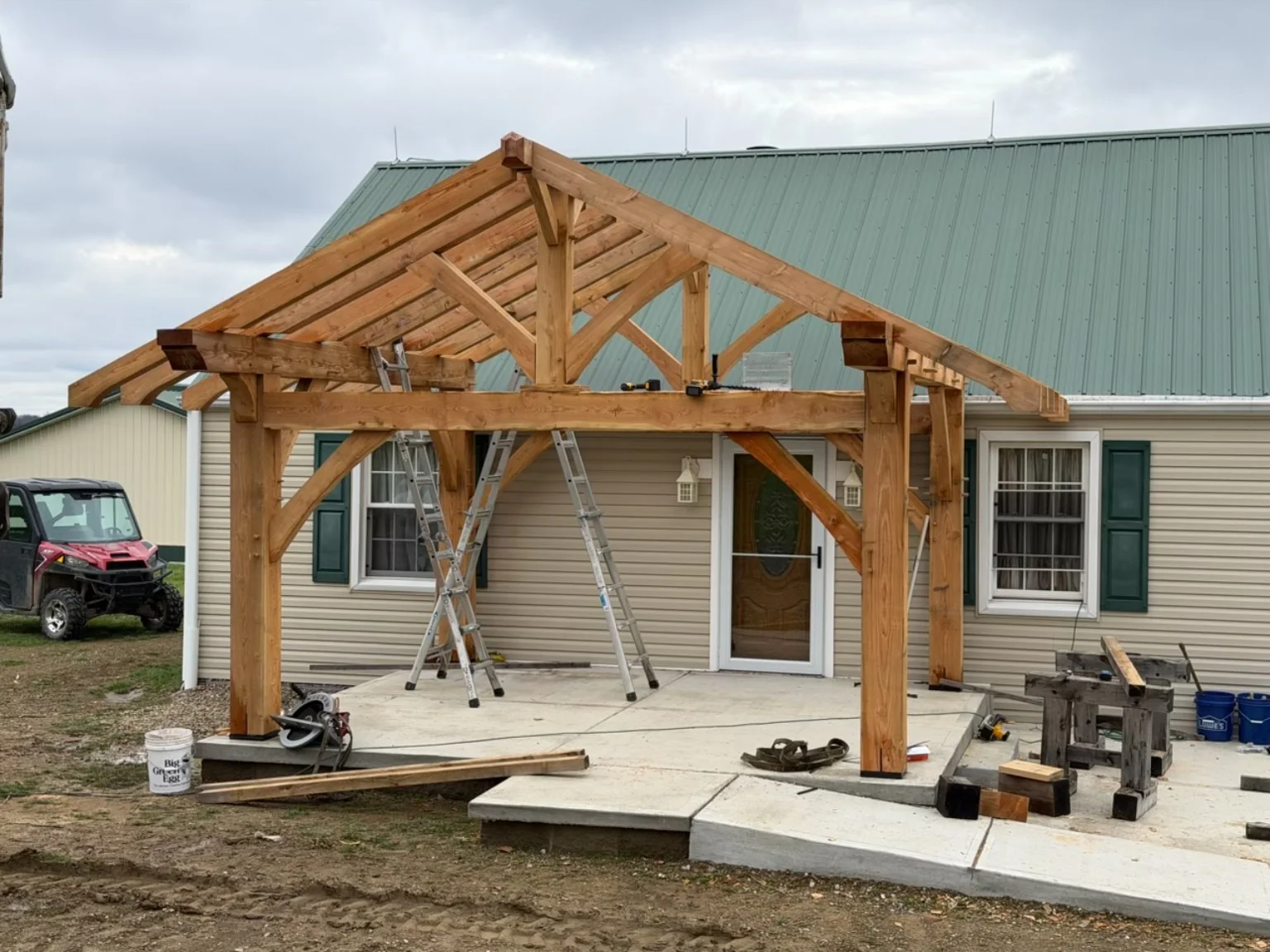 Front view of open-rafter hemlock timber-frame patio structure in Pittsburgh Pennsylvania